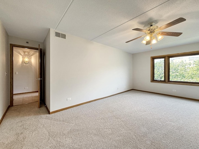 7120 N Milwaukee Ave Unit 305, Niles, IL 60714 - unfurnished room featuring light carpet, a textured ceiling, and a ceiling fan