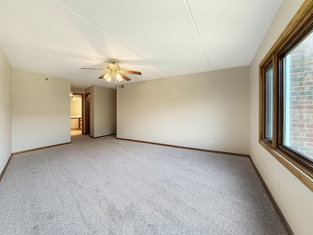 7120 N Milwaukee Ave Unit 305, Niles, IL 60714 - spare room with light carpet, plenty of natural light, and a ceiling fan