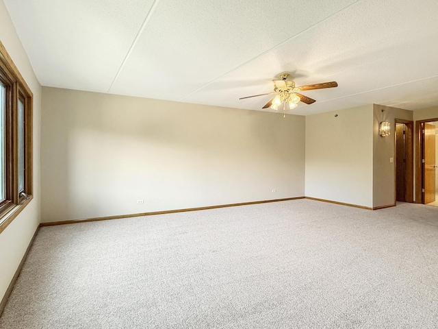 7120 N Milwaukee Ave Unit 305, Niles, IL 60714 - empty room with a ceiling fan, light colored carpet, and a textured ceiling