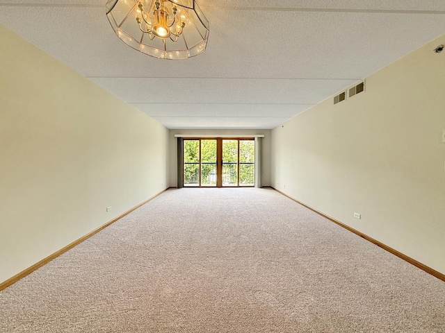 7120 N Milwaukee Ave Unit 305, Niles, IL 60714 - carpeted empty room with a chandelier and a textured ceiling