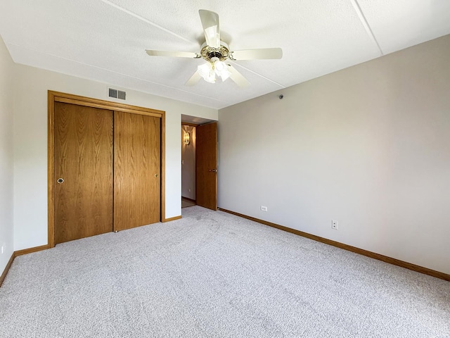 7120 N Milwaukee Ave Unit 305, Niles, IL 60714 - unfurnished bedroom with a closet, light colored carpet, and a ceiling fan