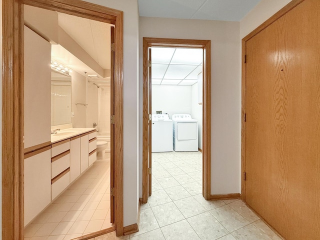 7120 N Milwaukee Ave Unit 305, Niles, IL 60714 - hall featuring washer and dryer and light tile patterned flooring