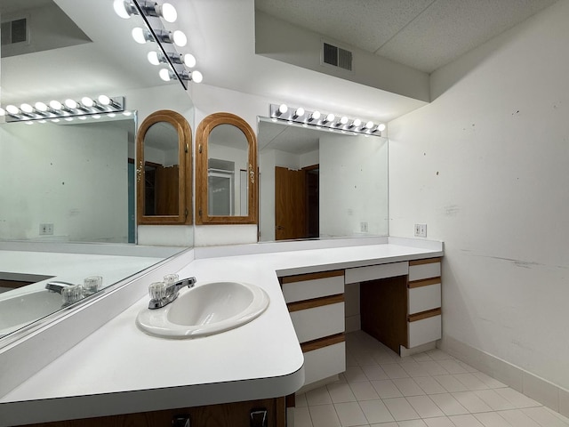 7120 N Milwaukee Ave Unit 305, Niles, IL 60714 - bathroom with visible vents, tile patterned floors, vanity, and baseboards