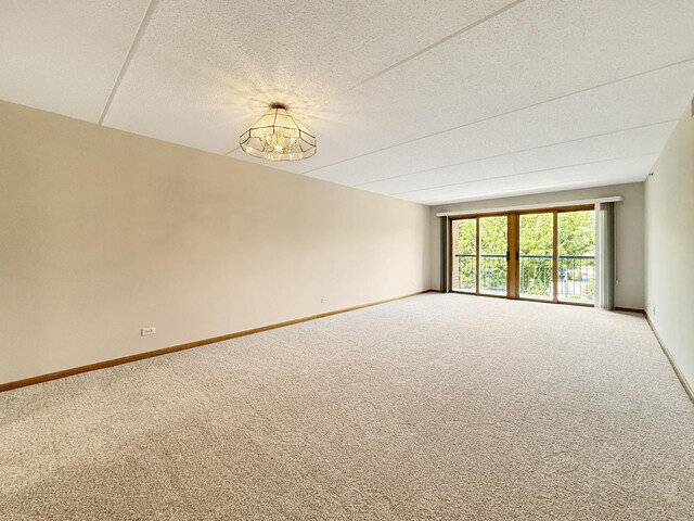 7120 N Milwaukee Ave Unit 305, Niles, IL 60714 - carpeted empty room featuring baseboards