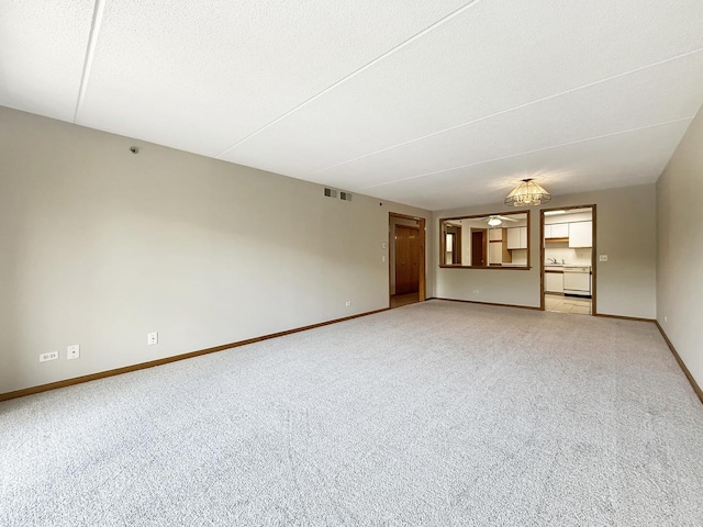 7120 N Milwaukee Ave Unit 305, Niles, IL 60714 - spare room with light colored carpet and a textured ceiling