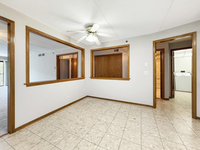 7120 N Milwaukee Ave Unit 305, Niles, IL 60714 - spare room featuring washer / dryer, a ceiling fan, and light tile patterned flooring