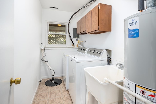 laundry area with gas water heater, washing machine and dryer, cabinet space, baseboards, and light flooring