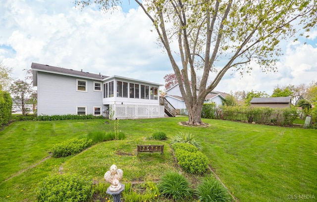 view of yard with a sunroom and stairs