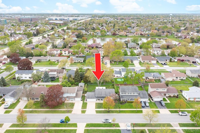aerial view of residential area with a nearby body of water