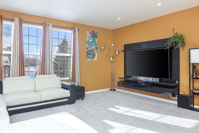 carpeted living room featuring baseboards and recessed lighting