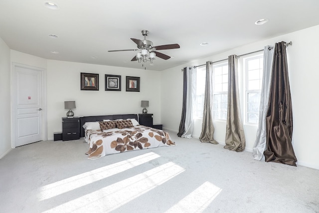 carpeted bedroom with recessed lighting, baseboards, and ceiling fan