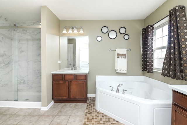 full bath with tile patterned floors, a marble finish shower, a tub with jets, and vanity