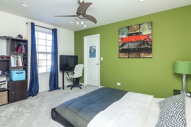 bedroom with carpet, baseboards, and a ceiling fan