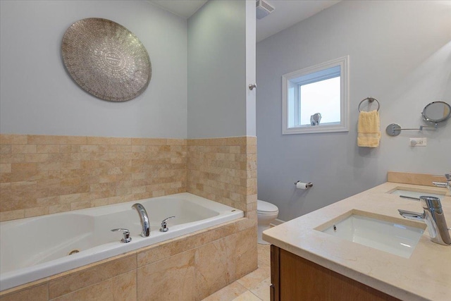 bathroom featuring a garden tub, visible vents, a sink, and toilet