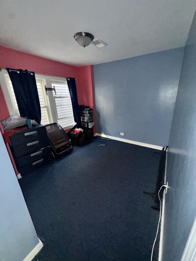 5015 N Kimberly Ave, Chicago, IL 60630 - exercise area with baseboards, visible vents, and carpet