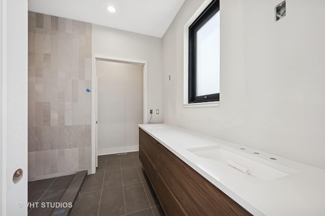full bathroom featuring recessed lighting, baseboards, tile patterned flooring, and vanity