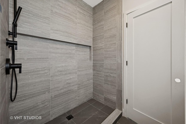 full bathroom with a tile shower