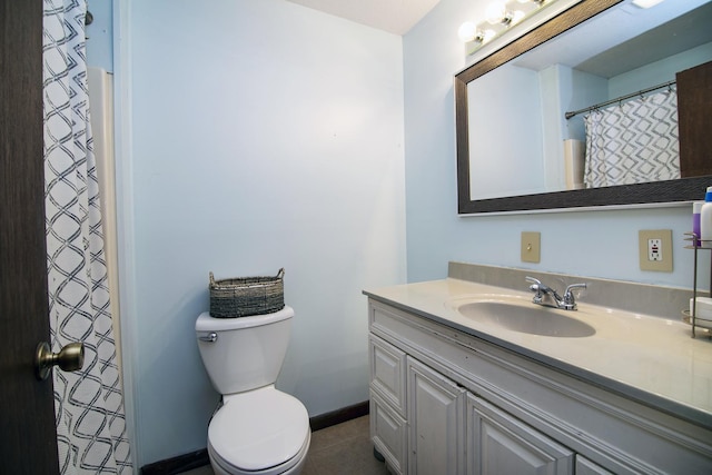 4618 W Hilltop Dr, Kankakee, IL 60901 - full bath with vanity, toilet, baseboards, and tile patterned flooring