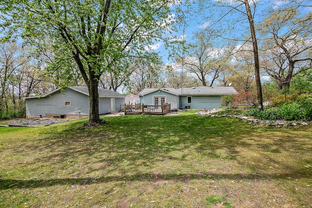 4618 W Hilltop Dr, Kankakee, IL 60901 - back of property featuring a wooden deck and a yard