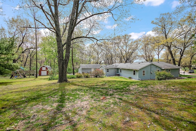 4618 W Hilltop Dr, Kankakee, IL 60901 - view of grassy yard featuring a playground