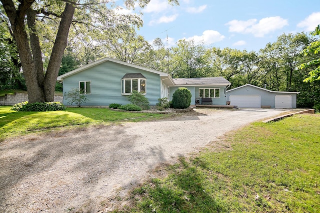 4618 W Hilltop Dr, Kankakee, IL 60901 - ranch-style home with a garage, a front lawn, and an outbuilding