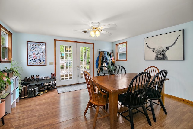 4618 W Hilltop Dr, Kankakee, IL 60901 - dining space with french doors, ceiling fan, and wood finished floors