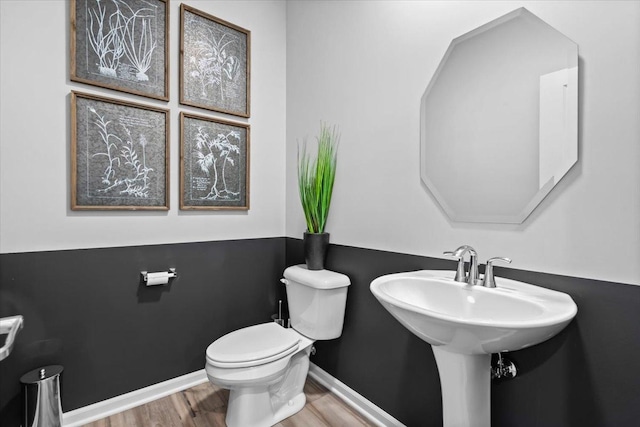 10340 Amos St, Huntley, IL 60142 - bathroom featuring baseboards, toilet, and wood finished floors