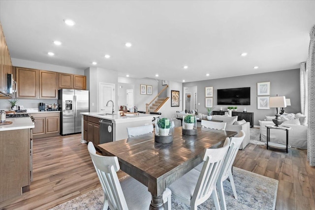 10340 Amos St, Huntley, IL 60142 - dining space featuring light wood-type flooring, recessed lighting, and stairs