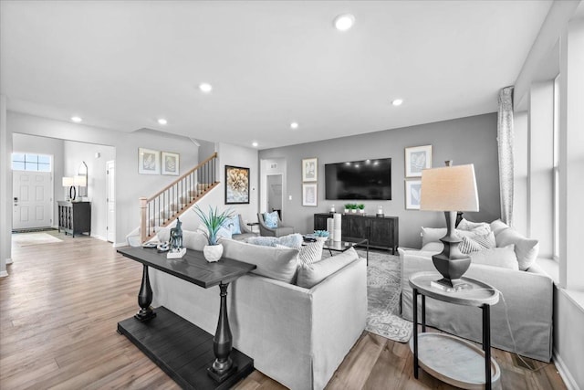 10340 Amos St, Huntley, IL 60142 - living area with baseboards, stairway, wood finished floors, and recessed lighting