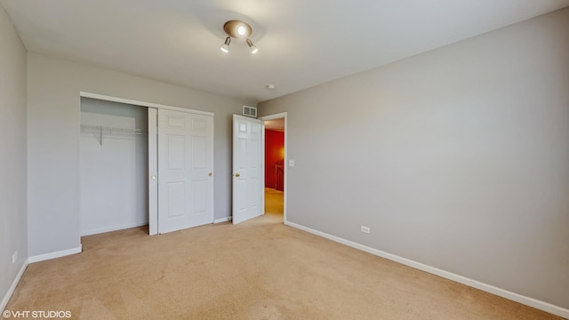 127 Charleston Ln, Gilberts, IL 60136 - unfurnished bedroom with light carpet, baseboards, and a closet