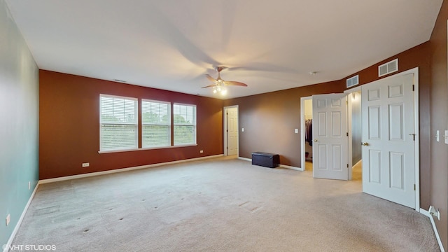 127 Charleston Ln, Gilberts, IL 60136 - unfurnished bedroom featuring light carpet, baseboards, and ceiling fan