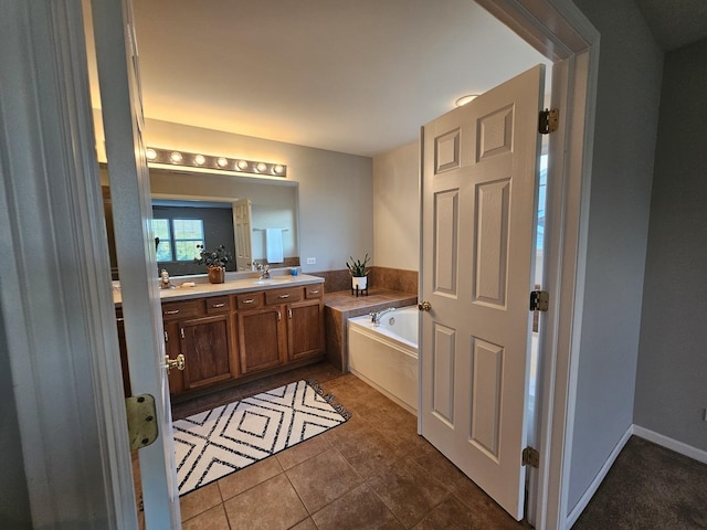 127 Charleston Ln, Gilberts, IL 60136 - full bathroom with a garden tub, double vanity, and tile patterned floors