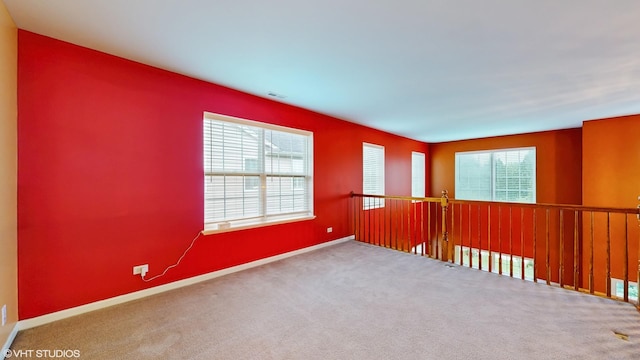127 Charleston Ln, Gilberts, IL 60136 - carpeted empty room featuring healthy amount of natural light and baseboards