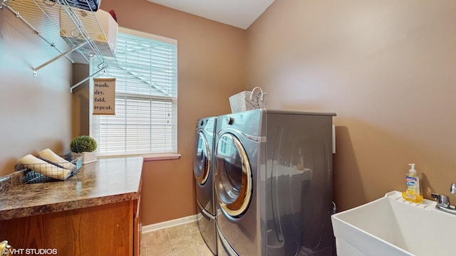 127 Charleston Ln, Gilberts, IL 60136 - laundry area with washing machine and dryer, a sink, and baseboards