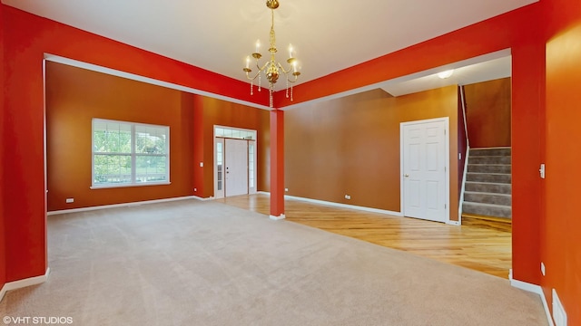 127 Charleston Ln, Gilberts, IL 60136 - carpeted spare room featuring a chandelier, stairs, and baseboards