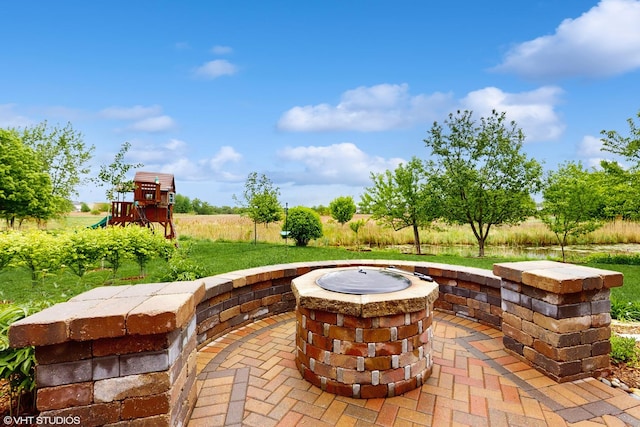 127 Charleston Ln, Gilberts, IL 60136 - view of patio with a fire pit and a playground