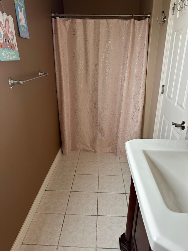 1028 Elizabeth St, Joliet, IL 60435 - full bath with a sink, a shower with shower curtain, and tile patterned floors