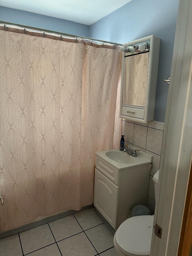 1028 Elizabeth St, Joliet, IL 60435 - bathroom featuring vanity, tile patterned floors, toilet, and curtained shower
