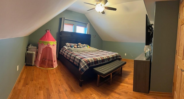 1028 Elizabeth St, Joliet, IL 60435 - bedroom featuring radiator, a ceiling fan, wood finished floors, and lofted ceiling