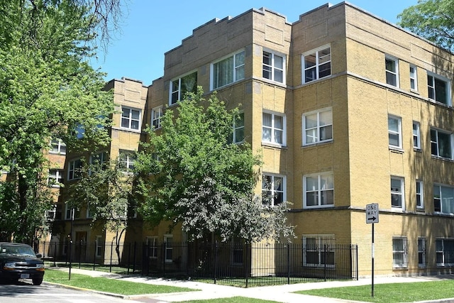 4909 N Avers Ave Unit 3, Chicago, IL 60625 - view of apartment building / complex featuring fence