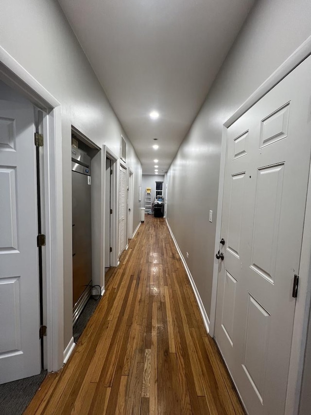 4909 N Avers Ave Unit 3, Chicago, IL 60625 - hallway with dark wood-style floors and baseboards