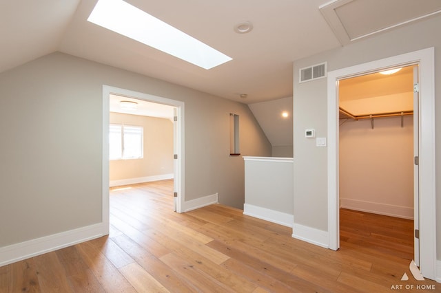 7902 W 105th St, Palos Hills, IL 60465 - bonus room with recessed lighting, vaulted ceiling with skylight, light wood-type flooring, visible vents, and baseboards