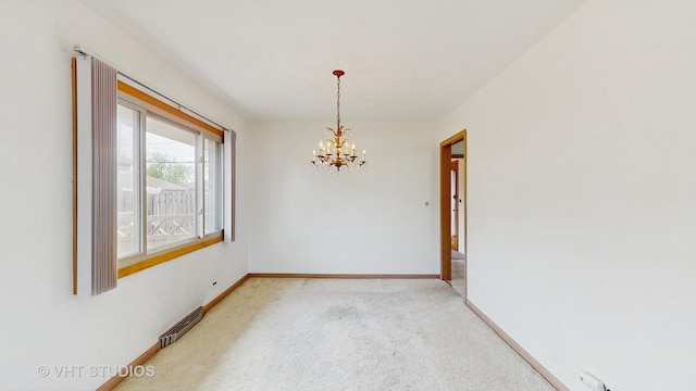 empty room featuring light colored carpet, baseboards, an inviting chandelier, and visible vents