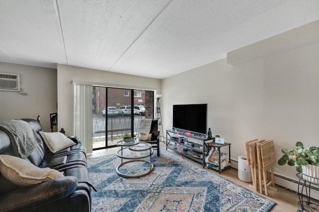 7117 W 93rd St Unit 102, Oak Lawn, IL 60453 - living room featuring an AC wall unit, a baseboard radiator, wood finished floors, and a textured ceiling