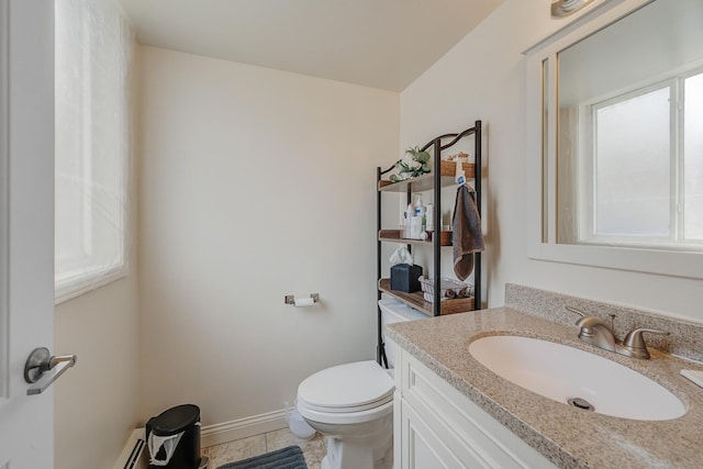 7117 W 93rd St Unit 102, Oak Lawn, IL 60453 - bathroom featuring toilet, vanity, baseboards, and tile patterned flooring