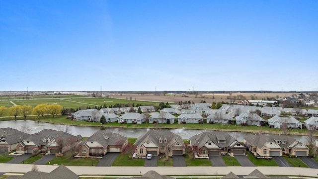 aerial view with a water view and a residential view