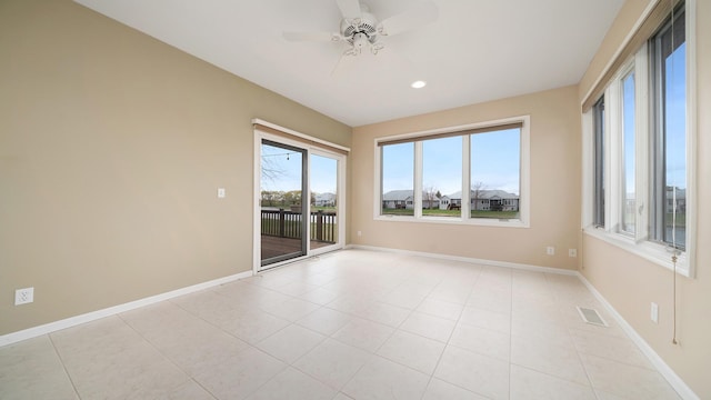 empty room with light tile patterned flooring, ceiling fan, recessed lighting, baseboards, and visible vents