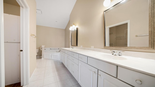 bathroom with double vanity, lofted ceiling, toilet, tile patterned floors, and a sink