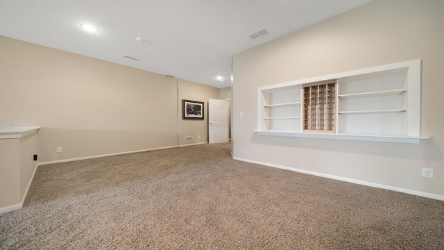 carpeted spare room featuring baseboards, recessed lighting, and visible vents