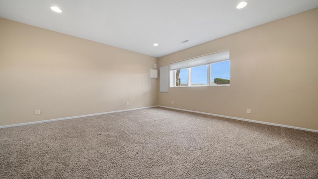 unfurnished room featuring baseboards, carpet, and recessed lighting